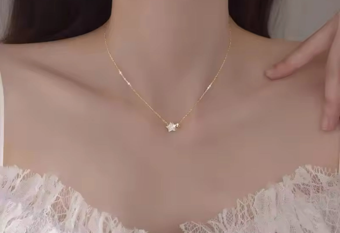 Gold start and heart necklace