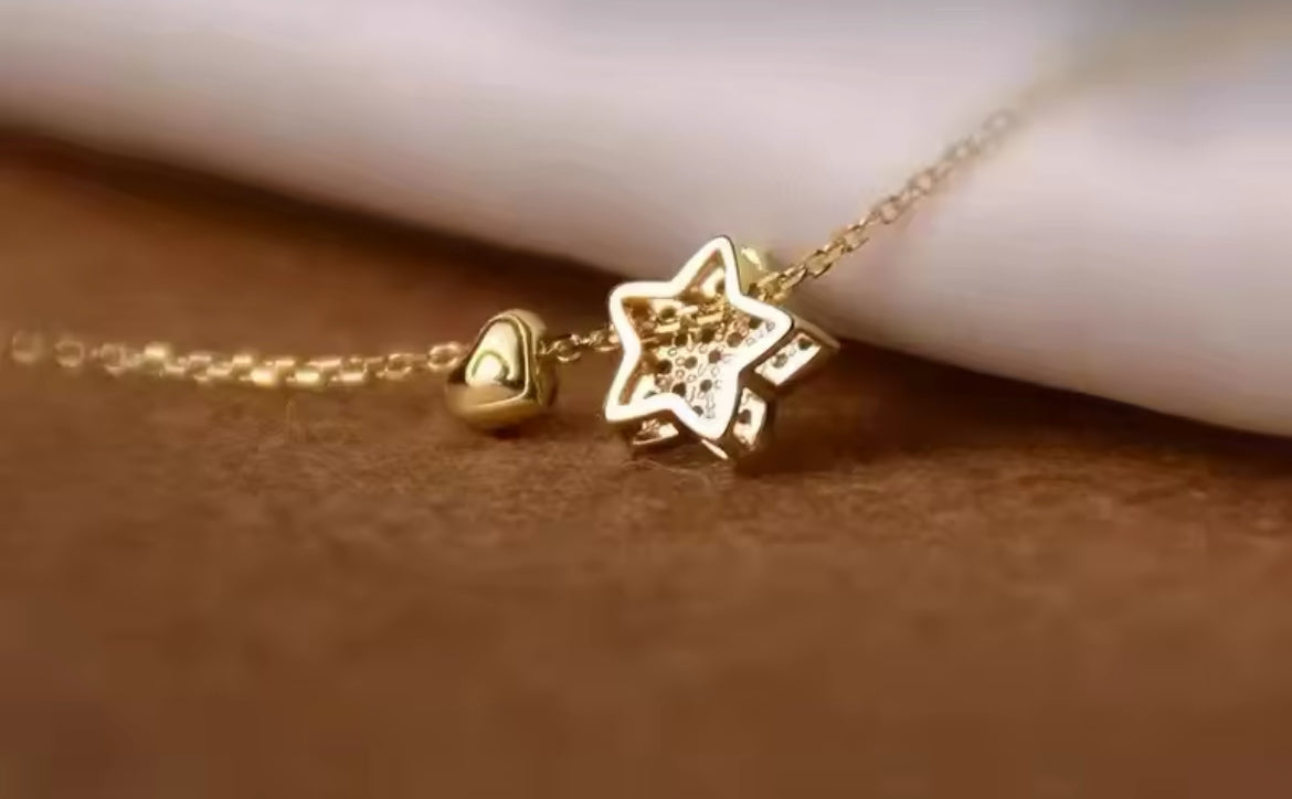 Gold start and heart necklace