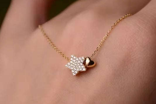 Gold start and heart necklace